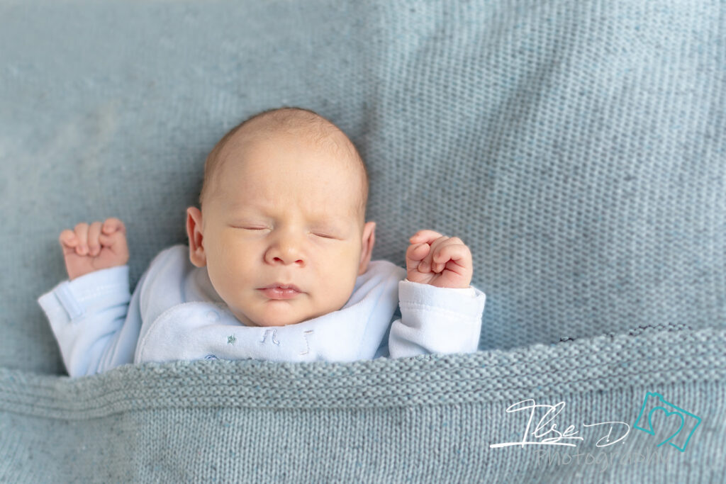 baby asleep on blanket