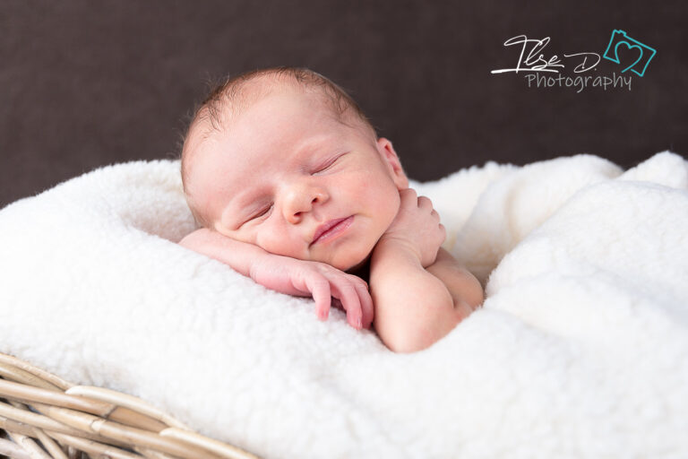 baby in basket asleep