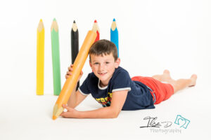 boy holding pencil