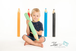 boy holding pencil